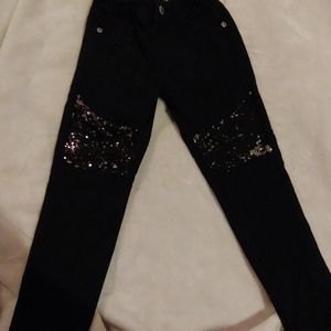 Girls black leggings with glitter knee detail